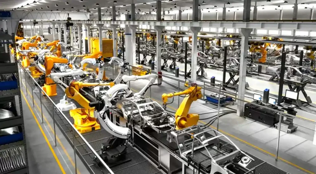 Robots industriales trabajando en línea de ensamblaje automatizada para el sector automotriz